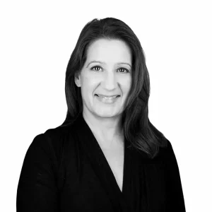 Professional woman smiling, black and white portrait