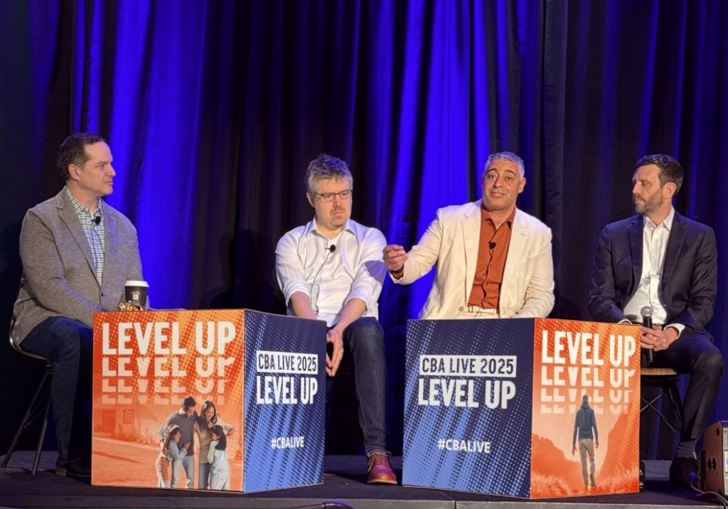 Four men discussing at CBA Live 2025 conference